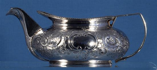 A George III silver sugar bowl and cream jug, by James Turner, bowl height 80mm, weight 17.8oz/556grms.